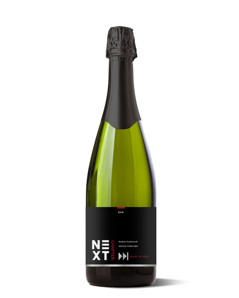 photograph of sparkling wine bottle