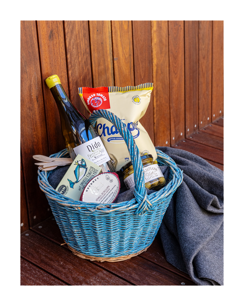 photograph of picnic basket with goodies inside